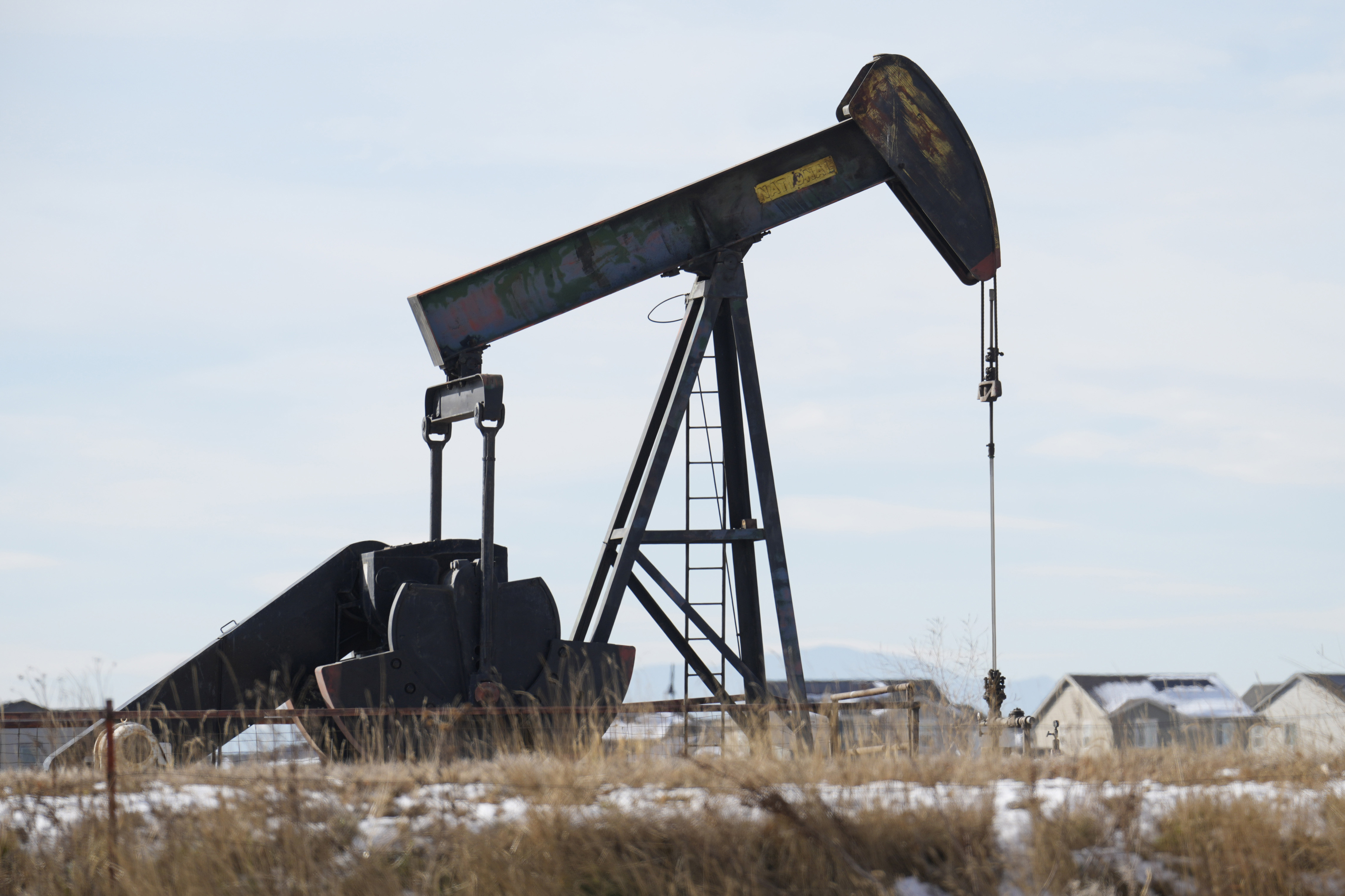 Oil prices gain amid steep drop in inventories as gasoline stockpiles rise