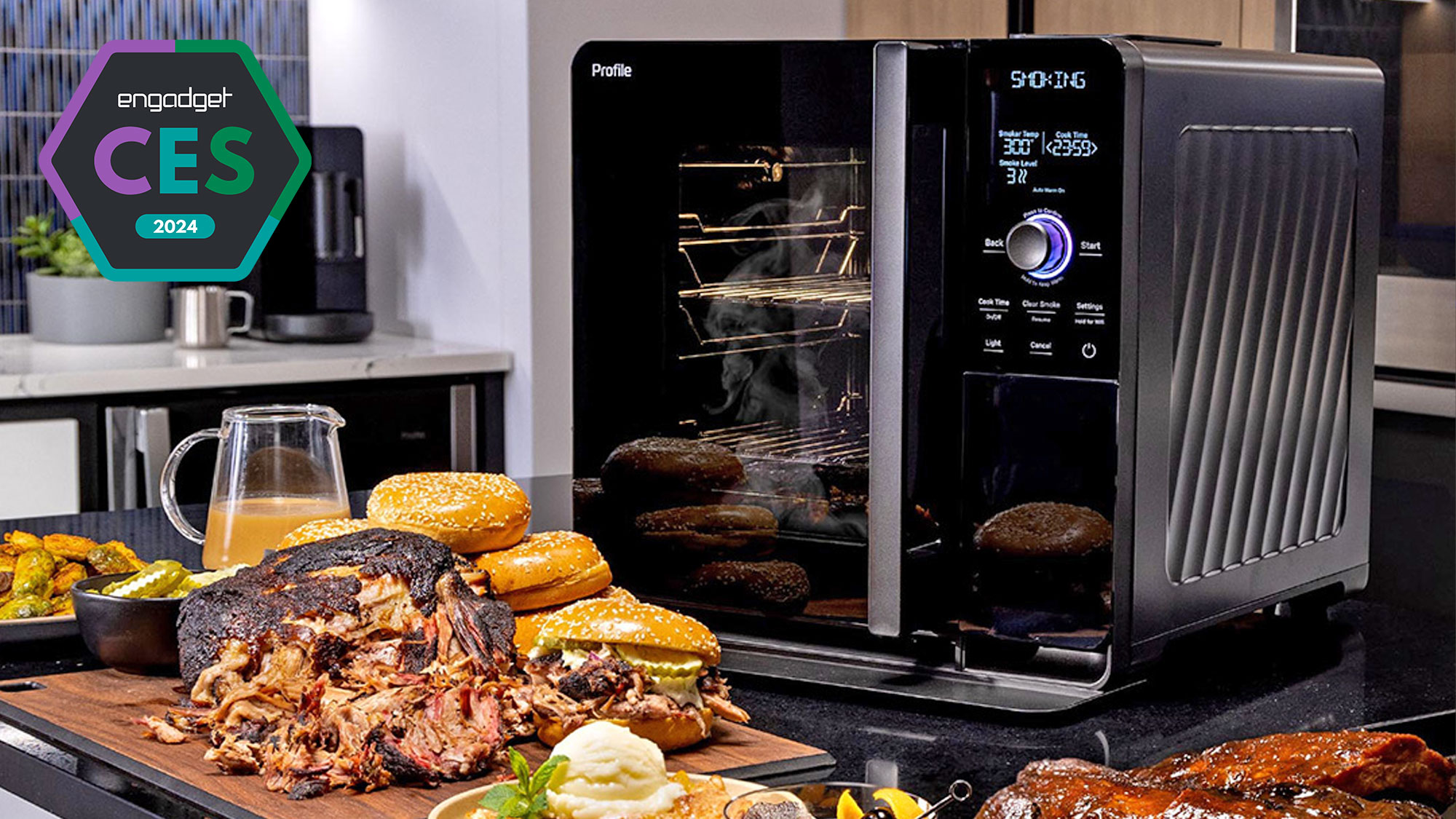 An image with a badge for Engadget Best of CES 2024 showing the product: GE Profile Smart Indoor Smoker on a crowded kitchen island surrounded by stacks of bristket and burger buns.