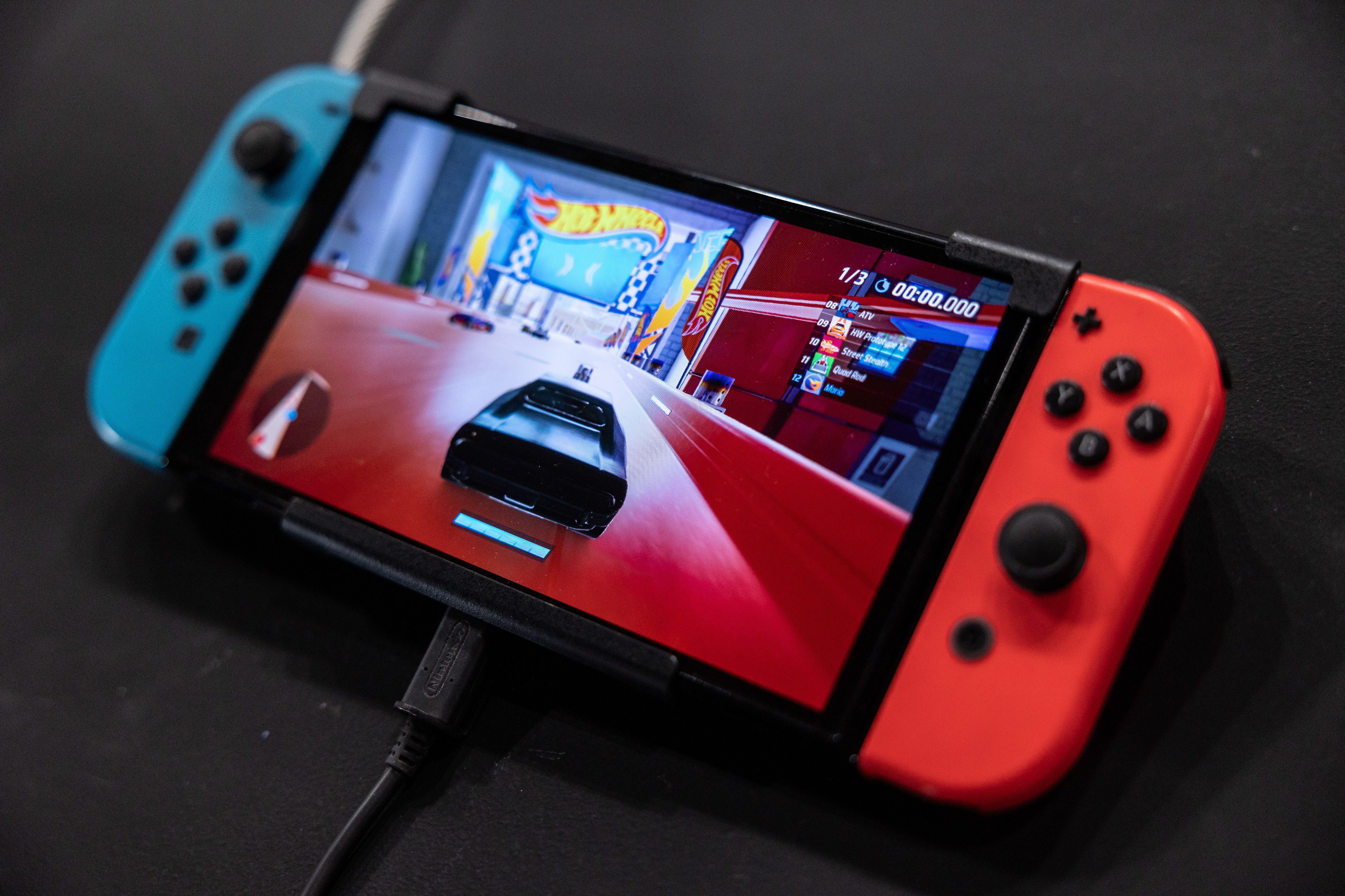 MILAN, ITALY - NOVEMBER 24: A general picture shows an Oled model Nintendo Switch gaming system at the Japanese publisher Nintendo Switch's stand during Milan Games Week 2023 at Rho Fieramilano on November 24, 2023 in Milan, Italy. Milan Games Week is the most important video games festival in Italy, featuring the latest news of gaming industry, the most exciting esports tournaments and amazing digital entertainment moments. (Photo by Emanuele Cremaschi/Getty Images)