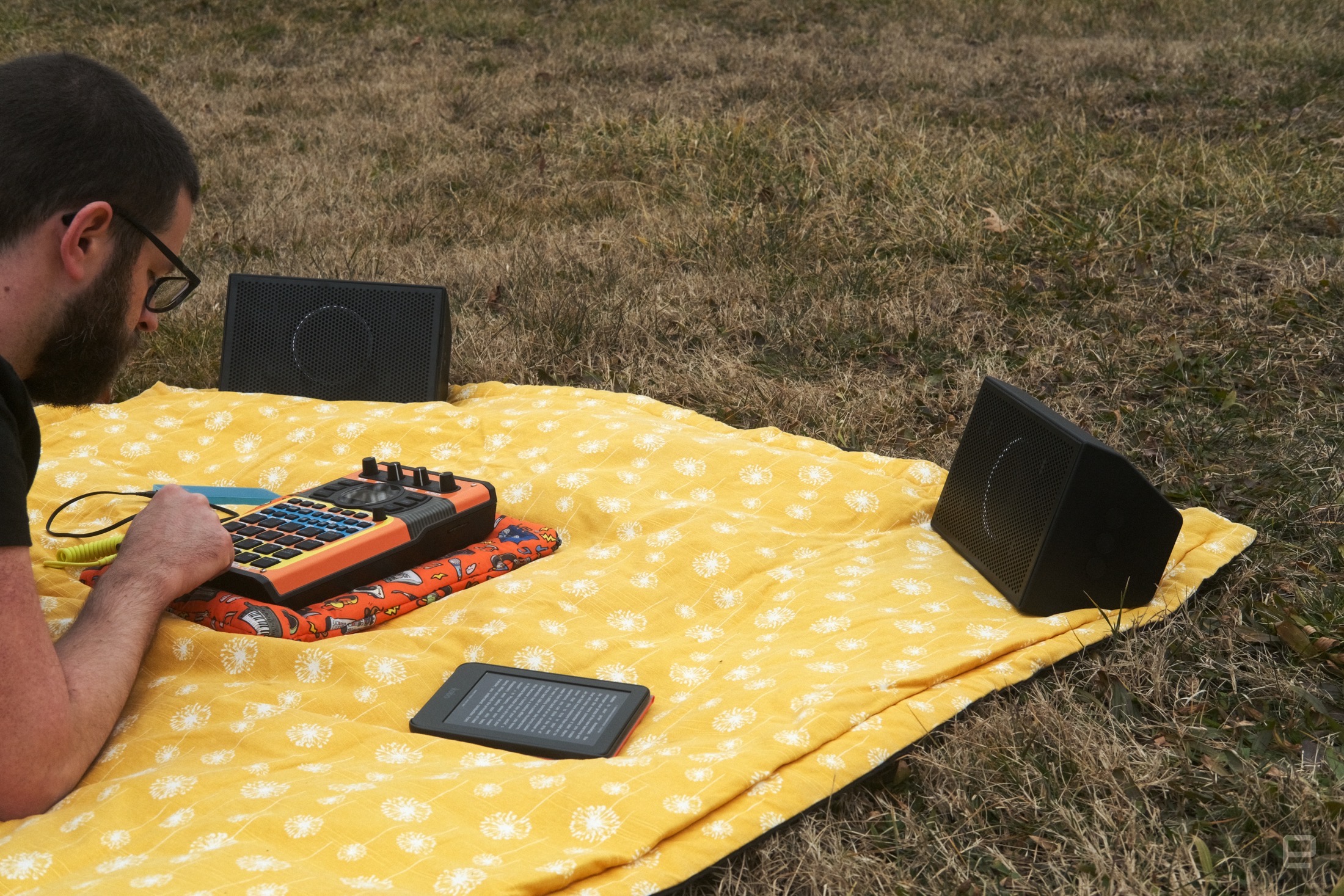 AIAIAI Unit 4 Wireless+ studio monitors in park on a picnic blanket while I annoys Saturday morning jogger by blasting mediocre beats from an SP-404 MKII.