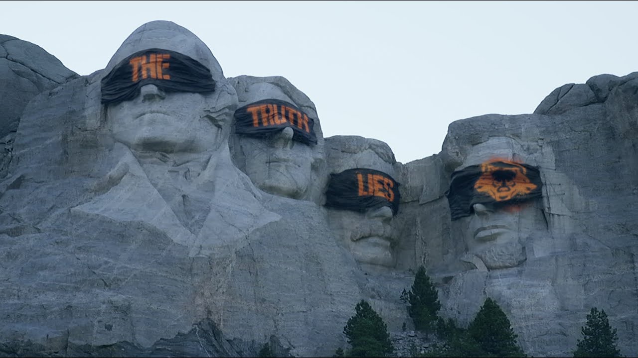 Marketing image for Call of Duty: Black Ops 6. Mount Rushmore, except the Presidents' eyes are covered with blindfolds that read 