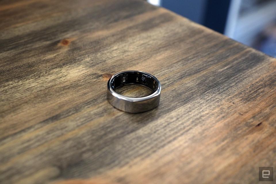 The third-generation Oura Ring sitting on a wooden table.