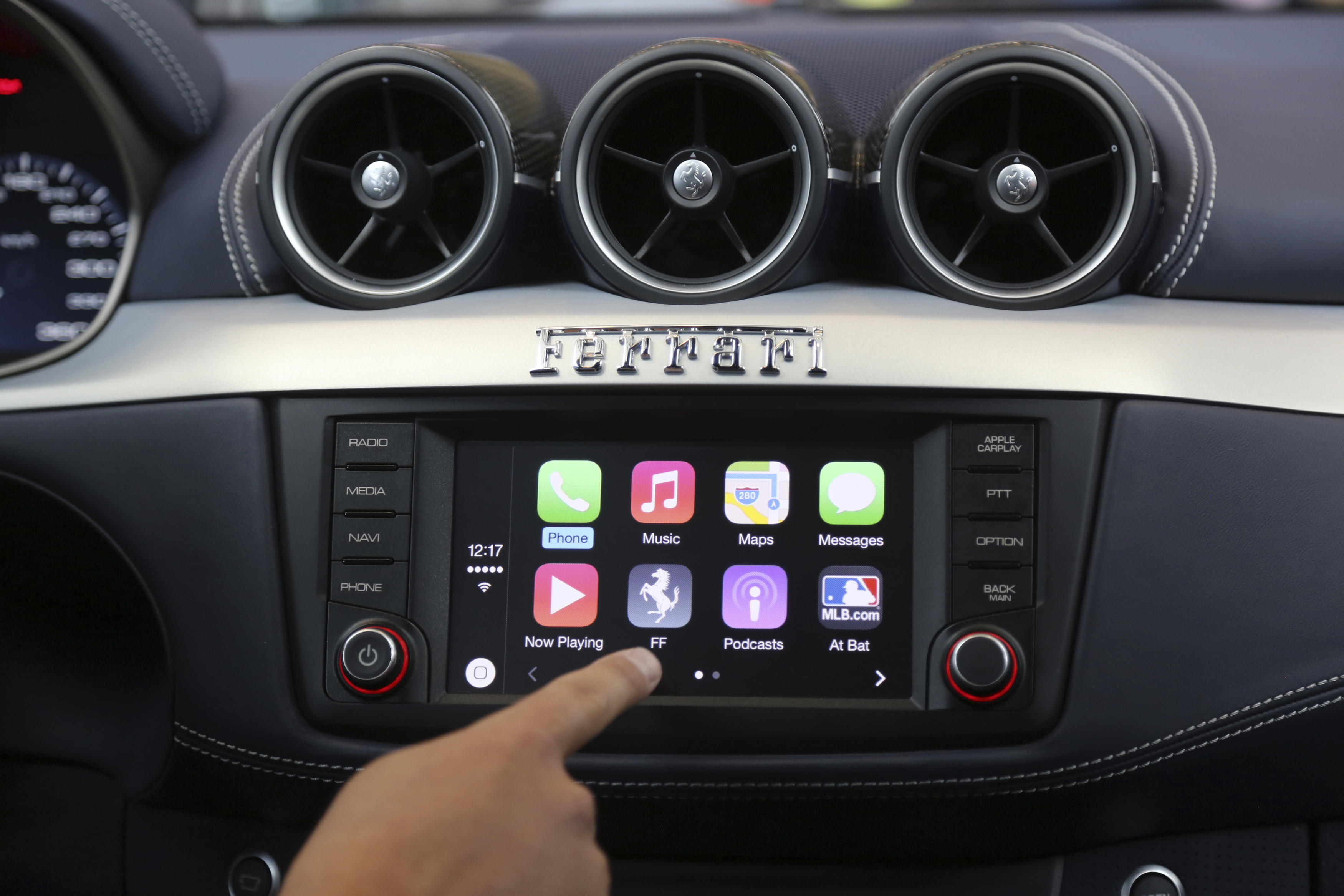 Apple's Stephen Chick displays the CarPlay program at the Worldwide Developers Conference in San Francisco, California June 2, 2014. REUTERS/Robert Galbraith  (UNITED STATES - Tags: BUSINESS SCIENCE TECHNOLOGY)