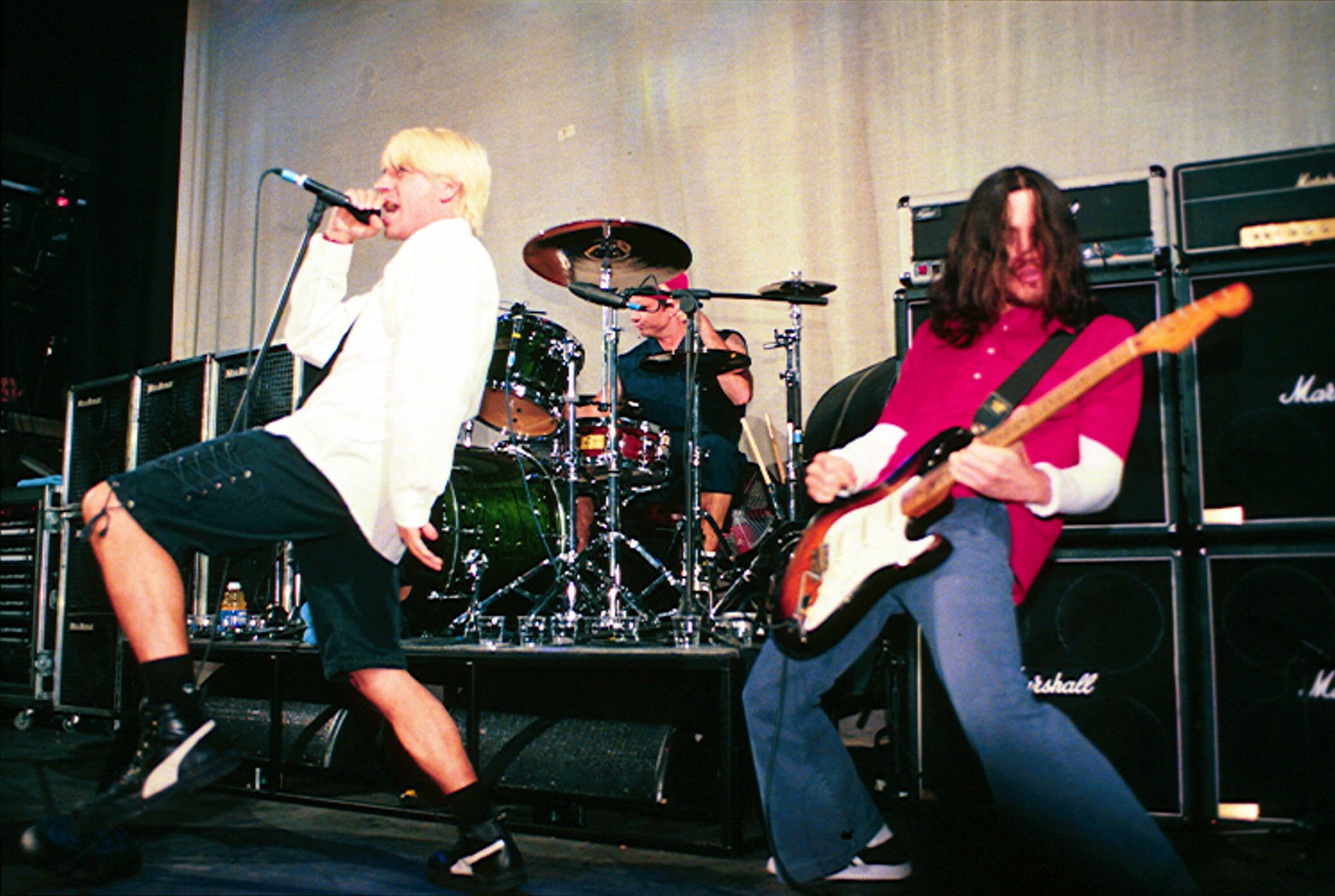 Red Hot Chili Peppers perform onstage in London in 1999.