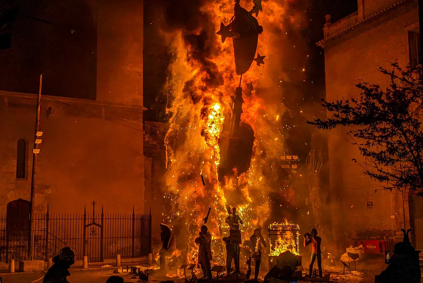 Photo of a fallas burning with very deep orange and black colors. 