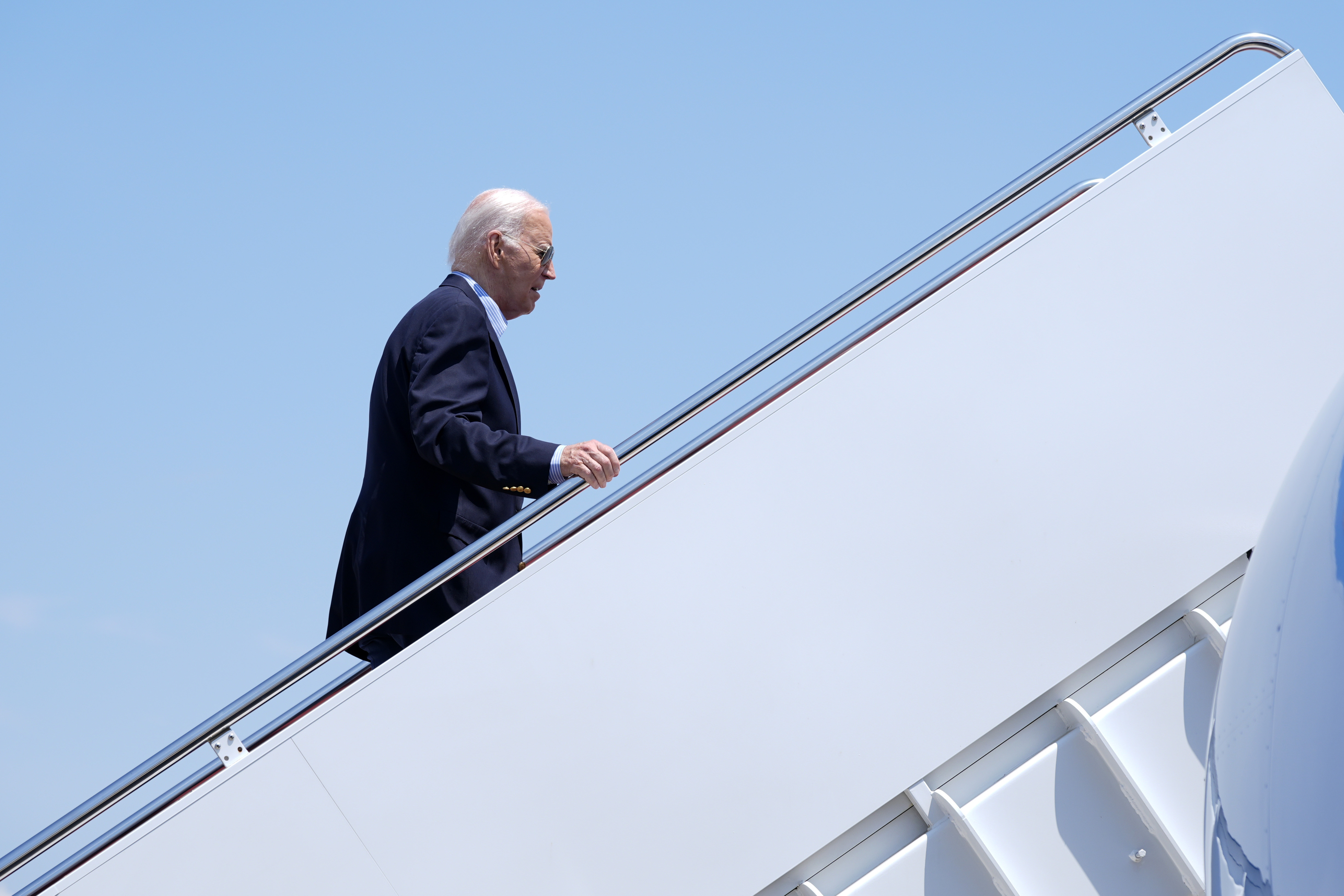 President Joe Biden boards Air Force One at Andrews Air Force Base, Md., as he leaves for a campaign trip to Madison, Wis., on Friday.