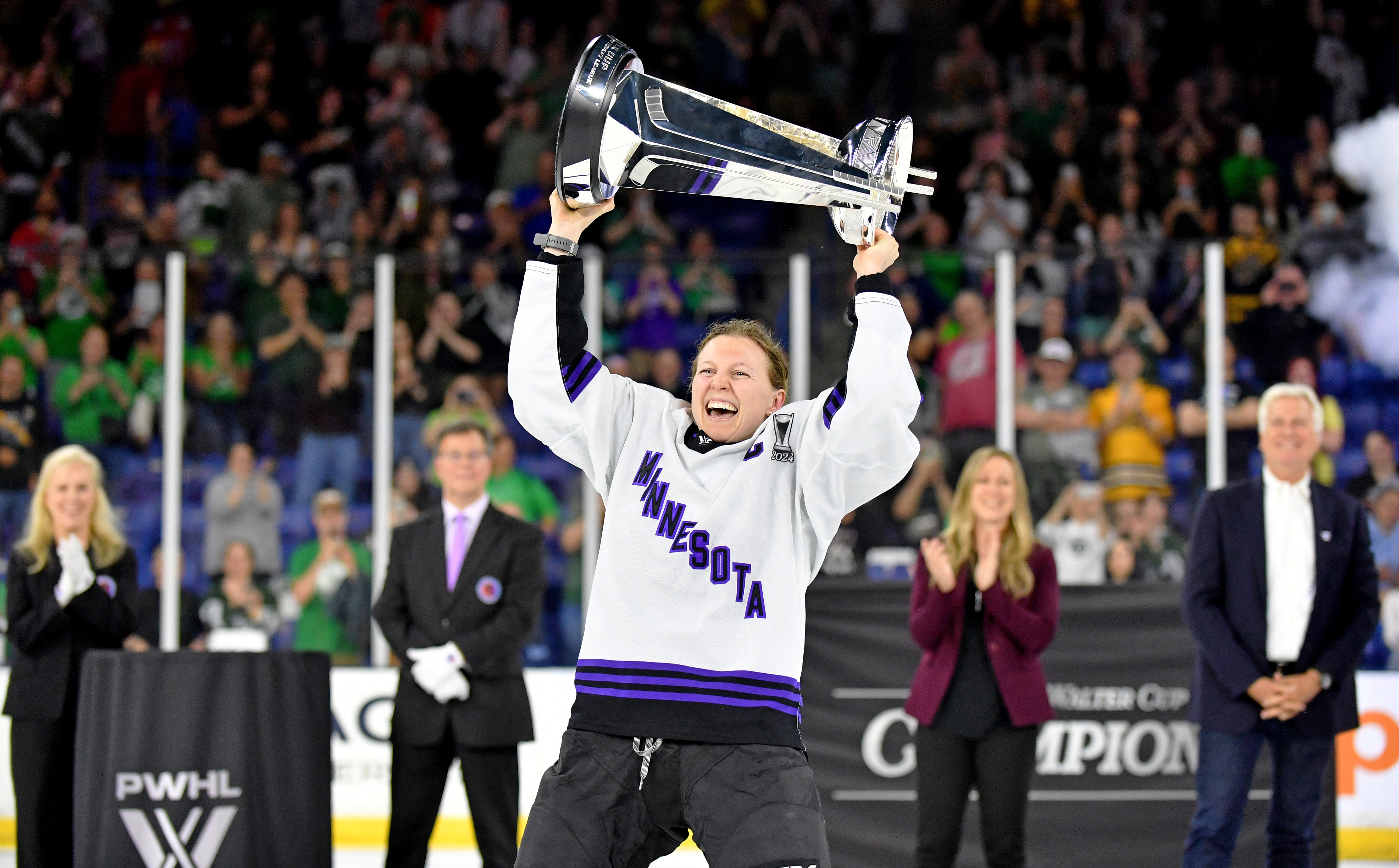 LOWELL, MASSACHUSETTS - MAY 29: Kendall Coyne Schofield #26 of Minnesota raises The Walter Cup after Minnesota defeated Boston at Tsongas Center on May 29, 2024 in Lowell, Massachusetts. (Photo by Troy Parla/Getty Images)