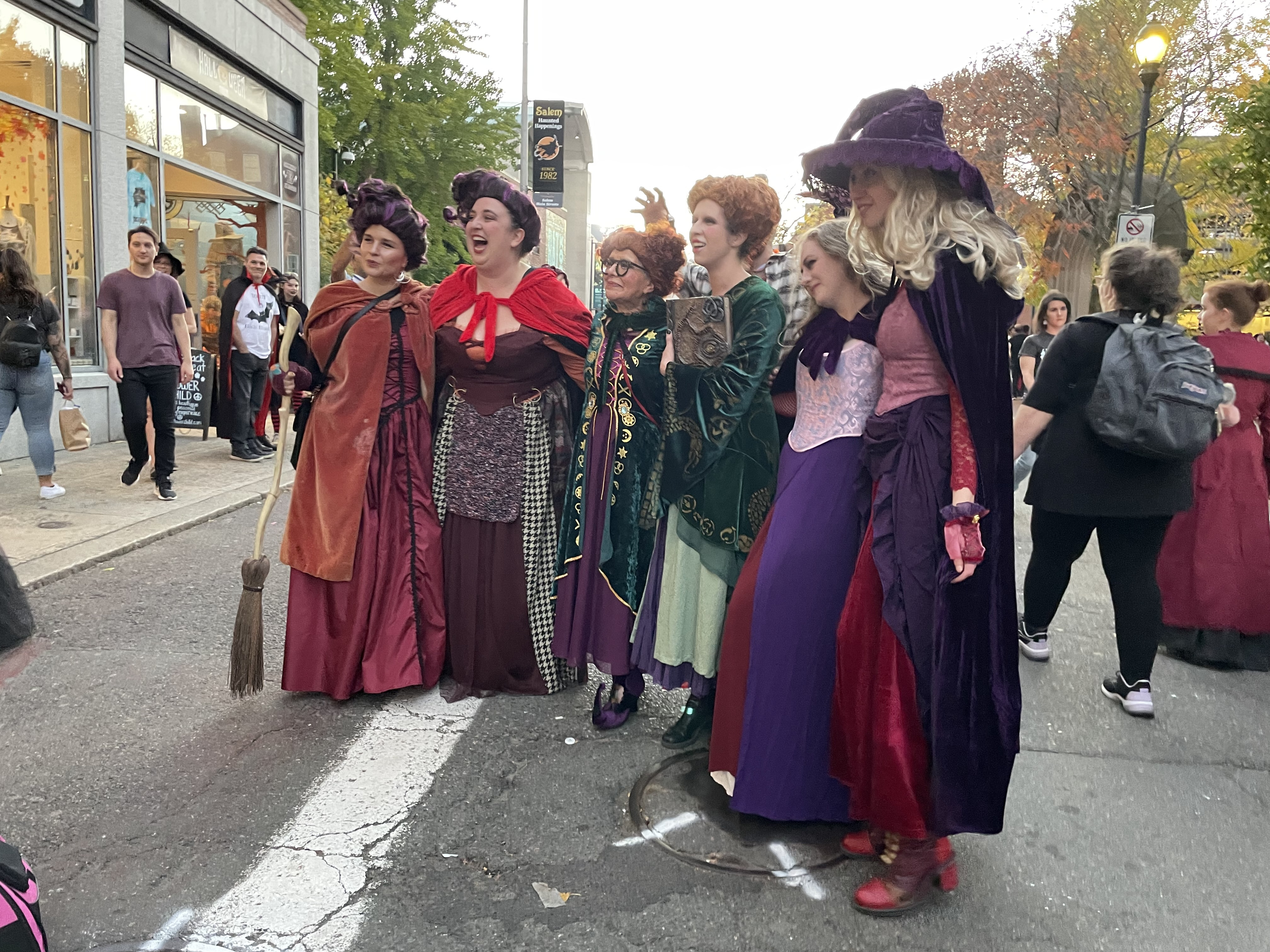 Salem MA, USA October 27th Friends stop by a Halloween celebration on a fall day to enjoy the crowds and show off their wardrobe