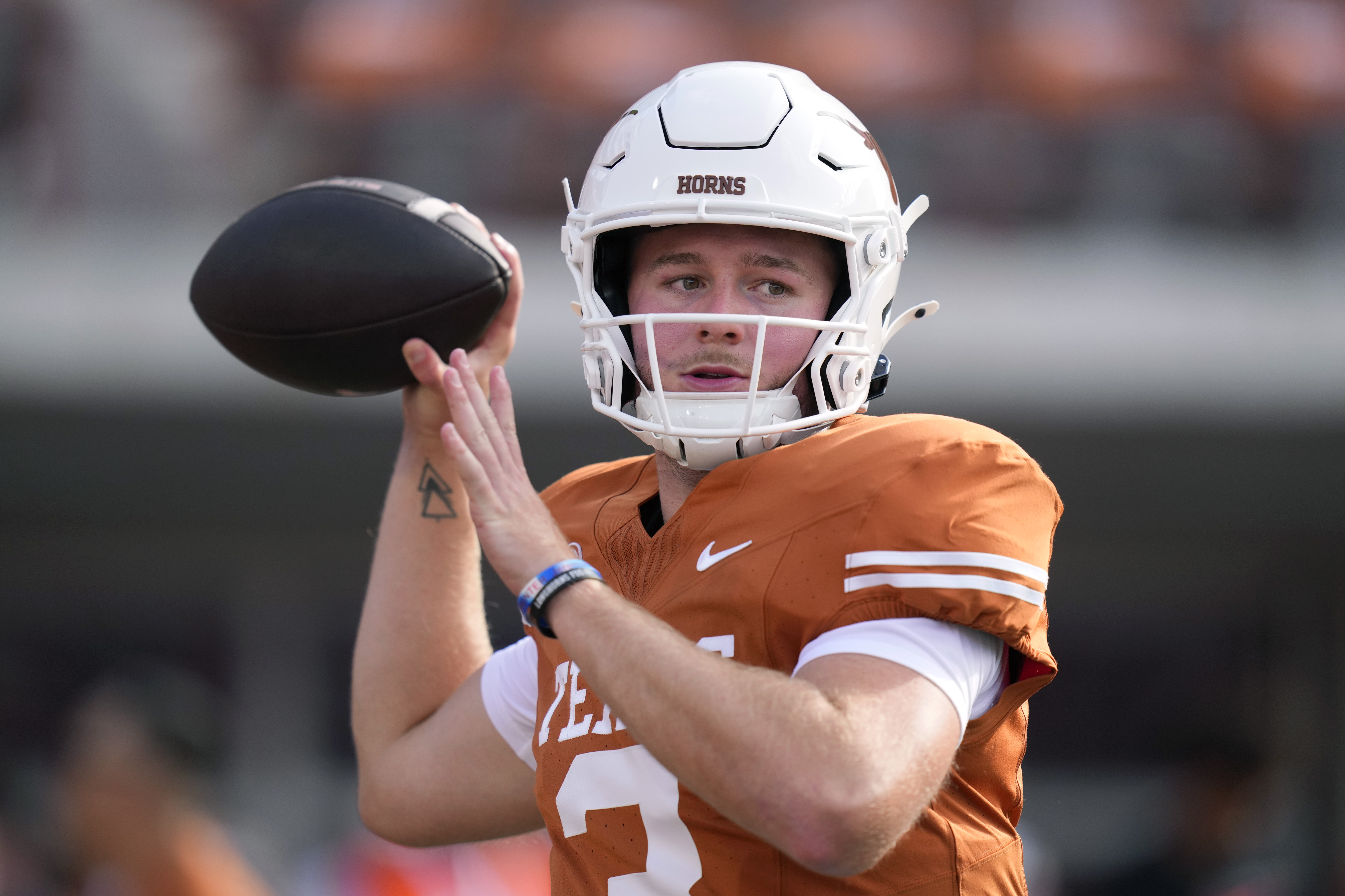 Texas quarterback Quinn Ewers (3) throws before an NCAA college football game against UTSA in Austin, Texas, Saturday, Sept. 14, 2024. (AP Photo/Eric Gay)