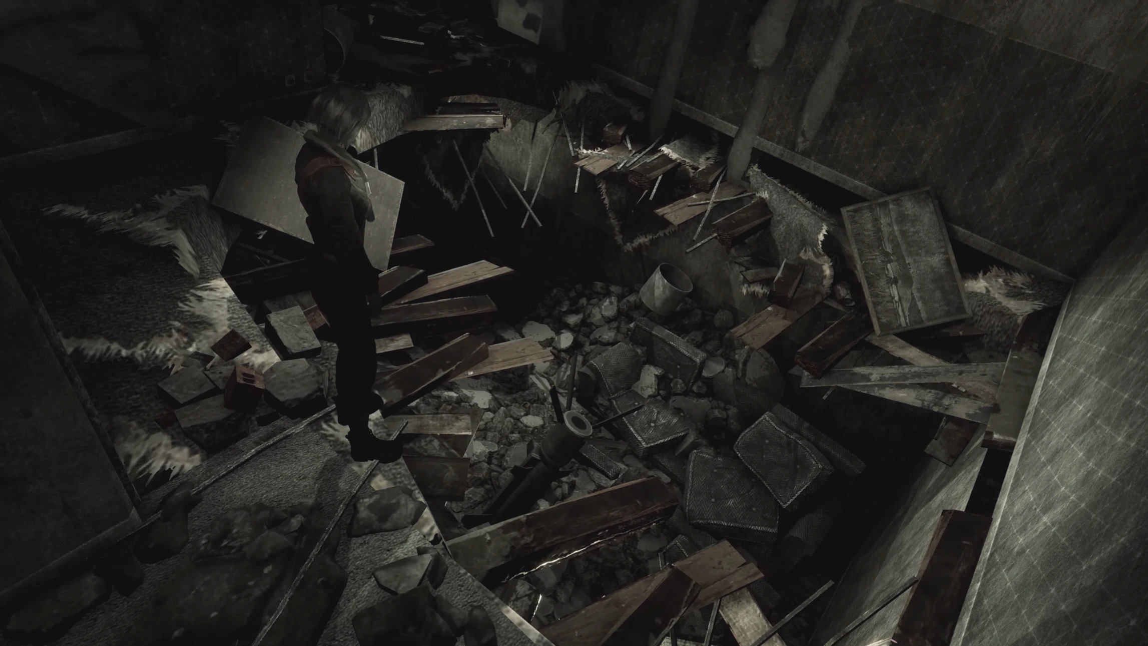 A still from Hollowbody showing the main character Mica standing over a large hole in an apartment floor, with debris all over