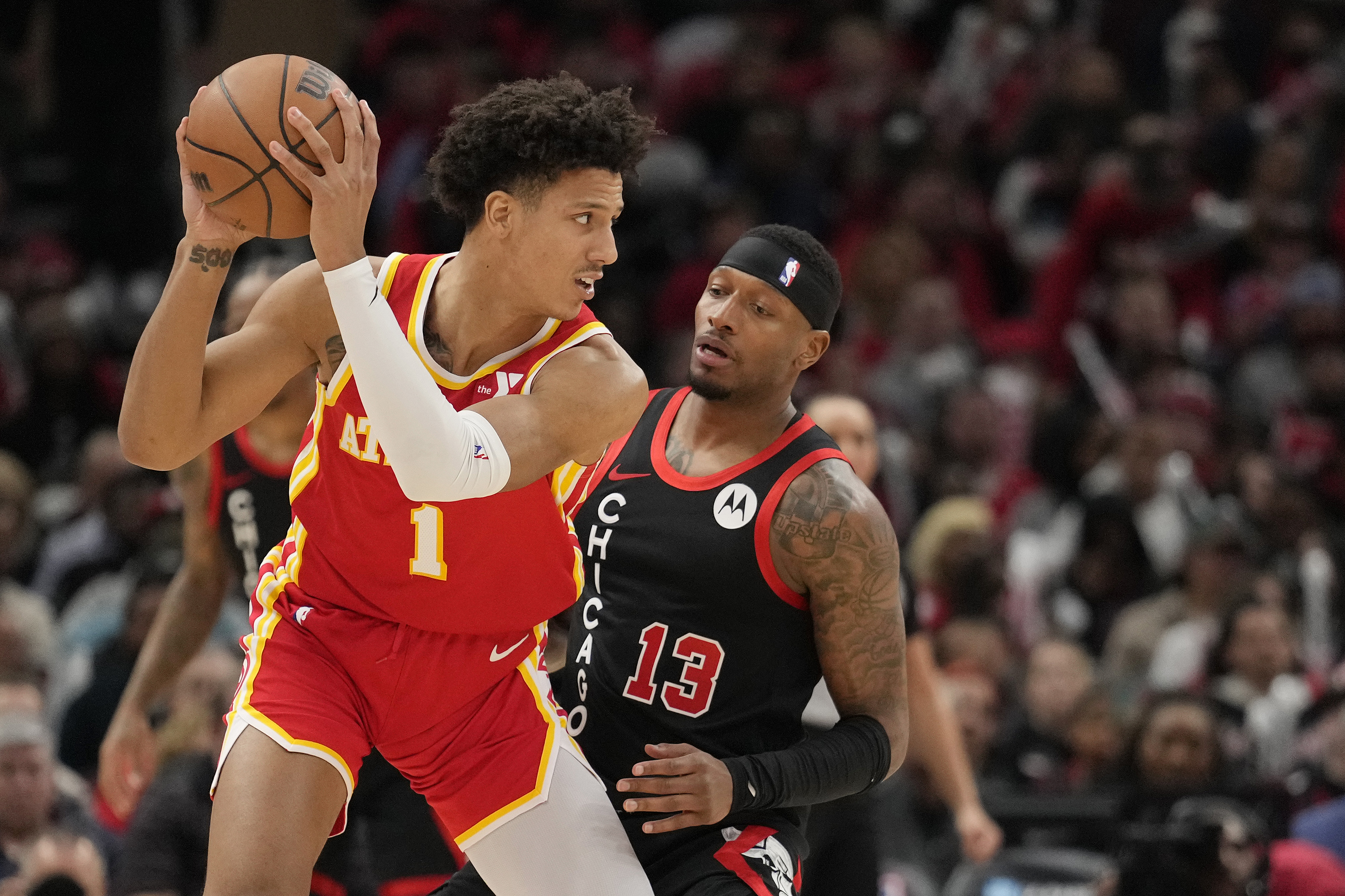 Jalen Johnson #1 of the Atlanta Hawks handles the ball against Torrey Craig #13 of the Chicago Bulls during the second half at the United Center on April 01, 2024 in Chicago, Illinois. NOTE TO USER: User expressly acknowledges and agrees that, by downloading and or using this photograph, User is consenting to the terms and conditions of the Getty Images License Agreement. (Photo by Patrick McDermott/Getty Images)