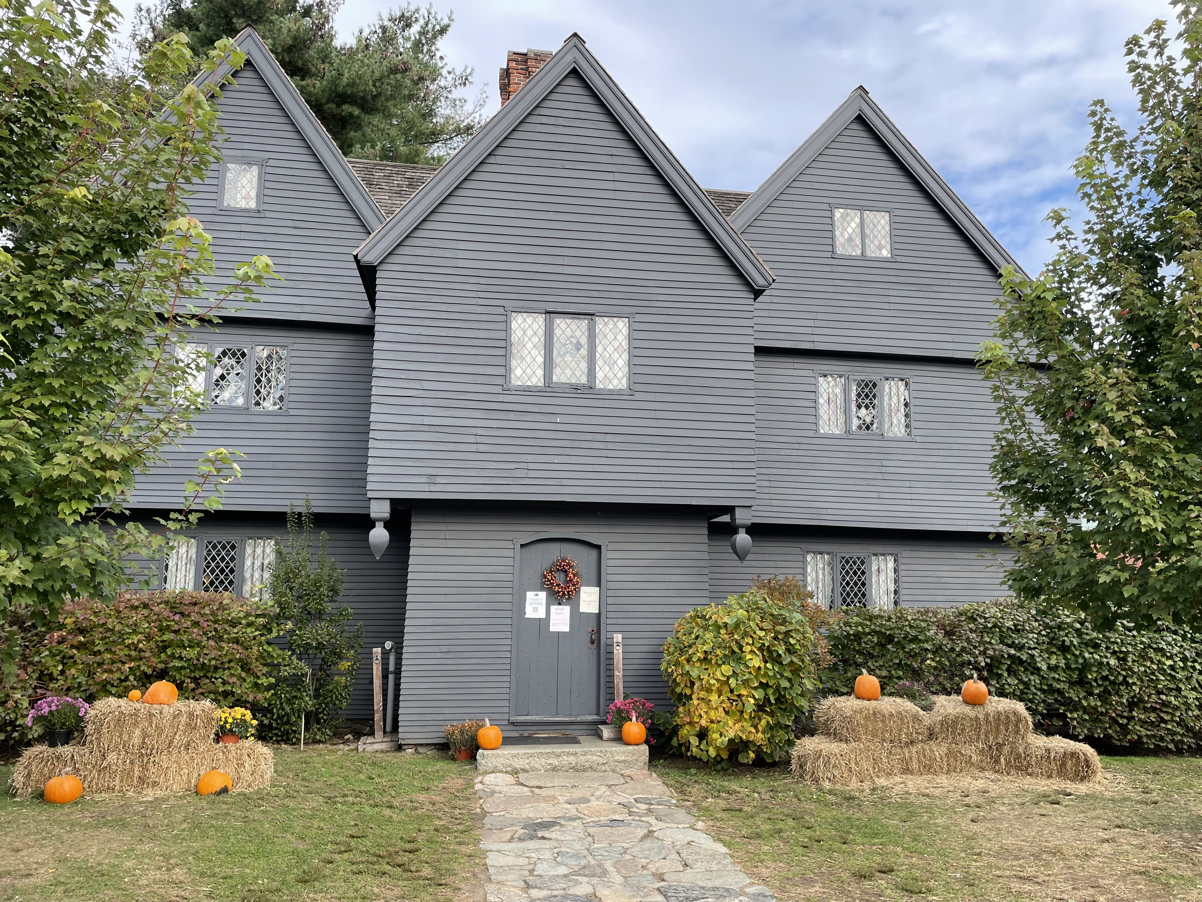 Salem, MA, USA October 26 Pumpkins and Halloween decorations are placed in the front yard of the Witch's House, a 17th century building associated with the Salem Witch Trials in Salem, Massachusetts