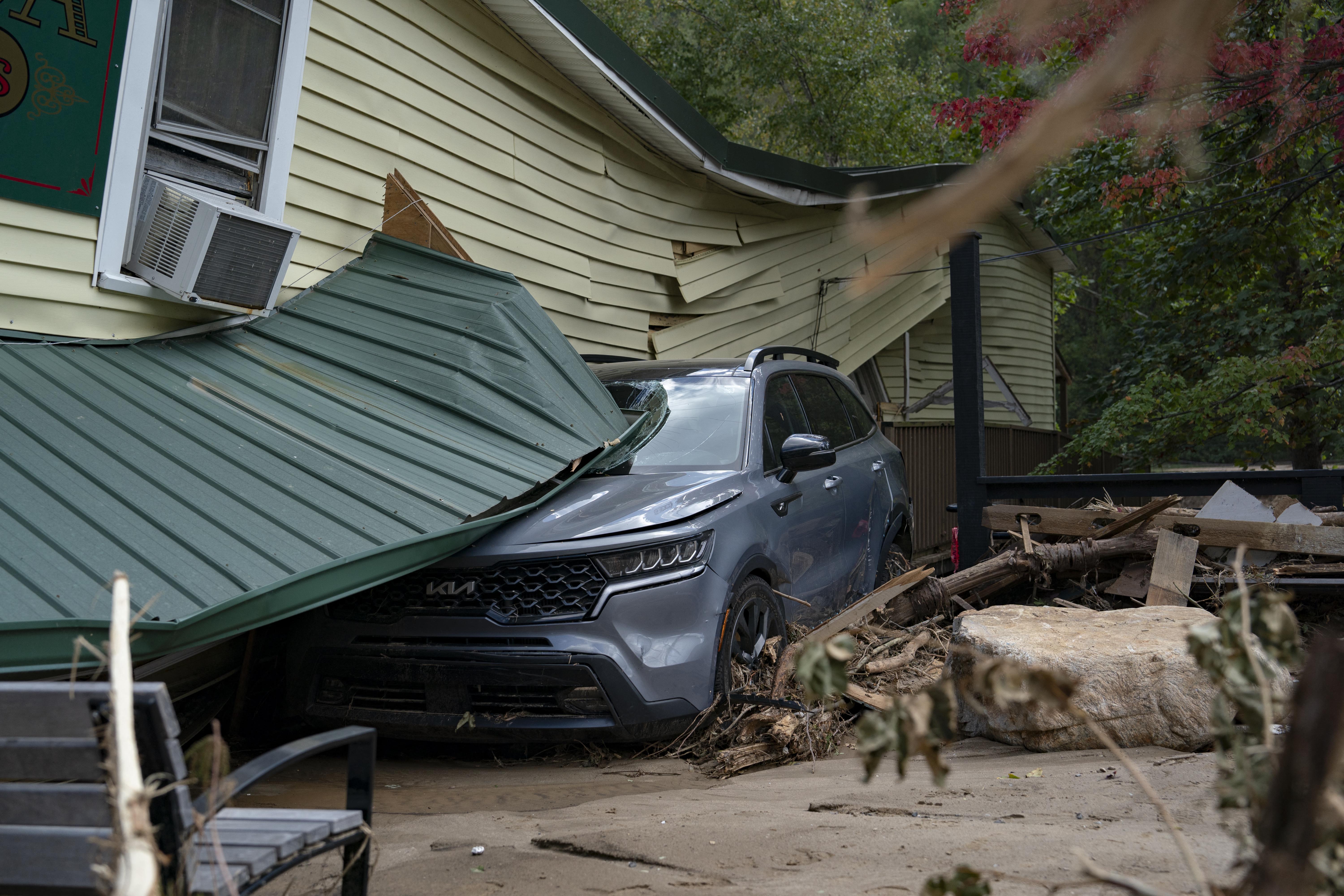 Damaged buildings and vehicles were spotted in downtown Chimney Rock, NC on the Wednesday following Hurricane Helene.