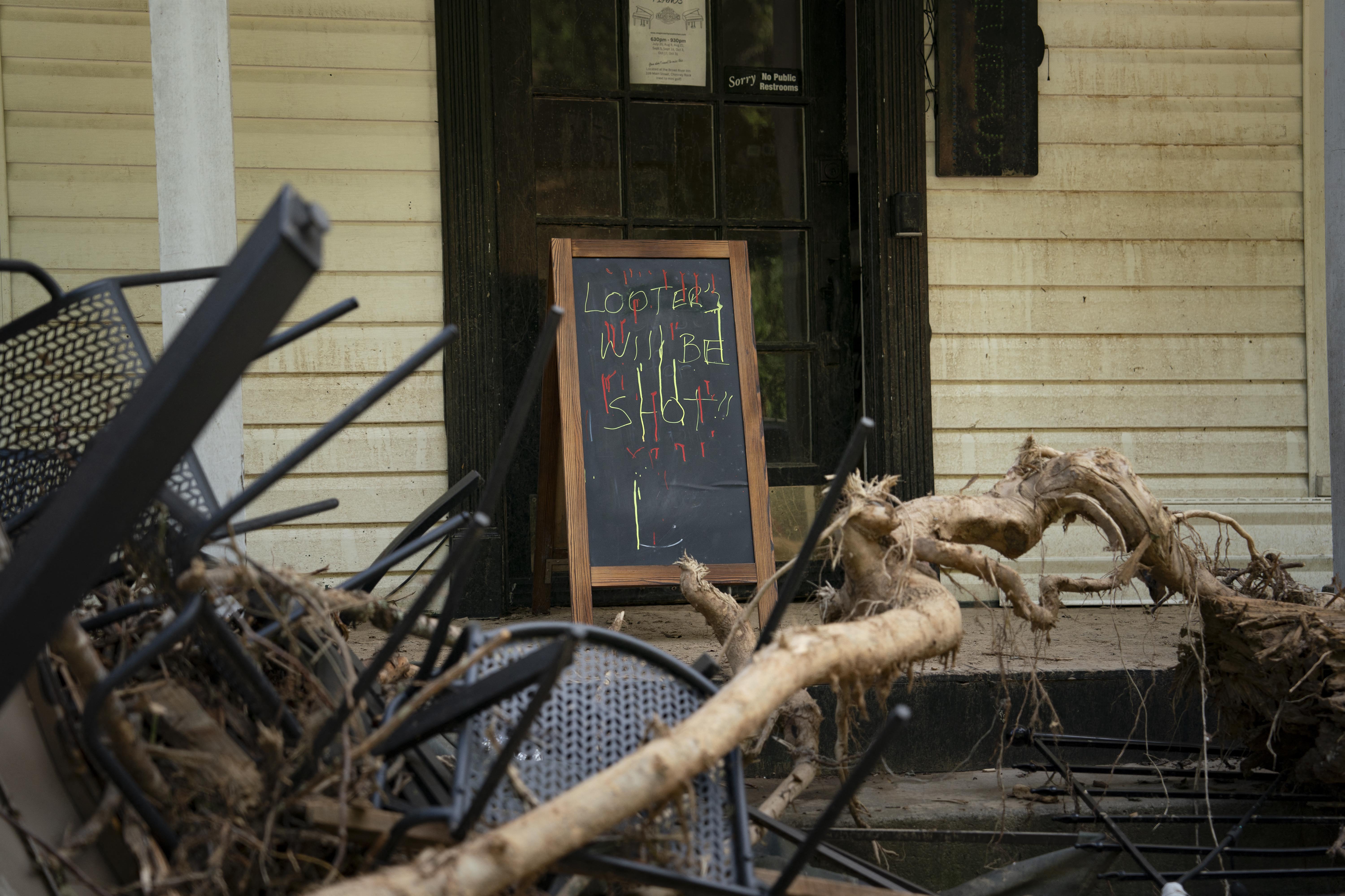 Debris is seen outside a store in downtown Chimney Rock, North Carolina, on the Wednesday after Hurricane Helene.