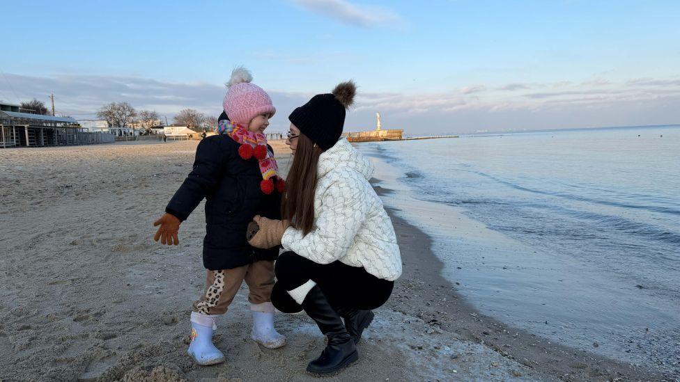 Under fire from the sea, families in Odesa try to escape Russian barrage