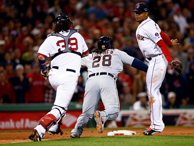 The Detroit Tigers' Prince Fielder, left, gives a fist bump to