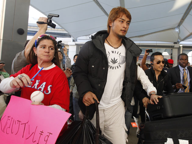 Far out: Was that a marijuana leaf t-shirt that Yu Darvish was sporting  today in Texas?