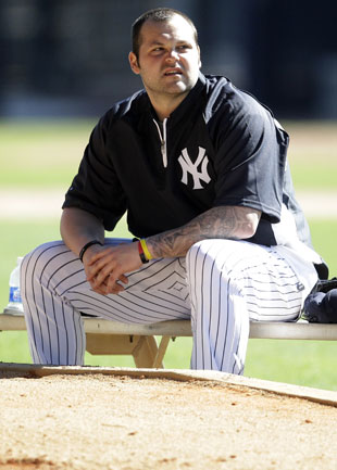 New York Yankees relief pitcher Joba Chamberlain places his crutches to the  side before speaking to reporters about hi smost recent injury, in Tampa,  Fla., Tuesday, March 27, 2012. Chamberlain injured his