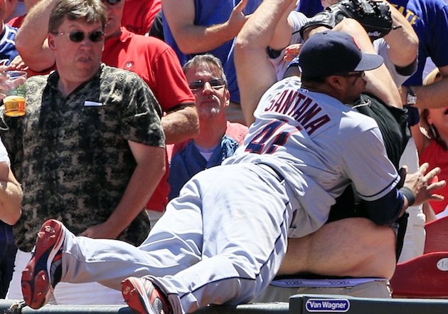 Carlos Santana levels fan in pursuit of foul ball