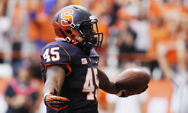 Syracuse football wearing white helmets, orange jerseys, white