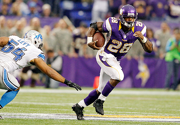 Running back Adrian Peterson of the Minnesota Vikings looks on in