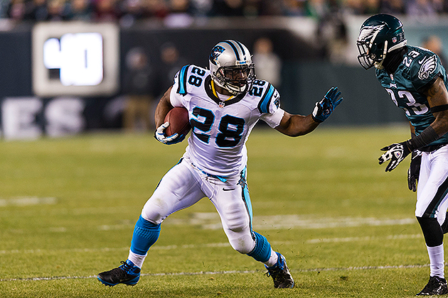 Carolina Panthers running back Jonathan Stewart, left, breaks free