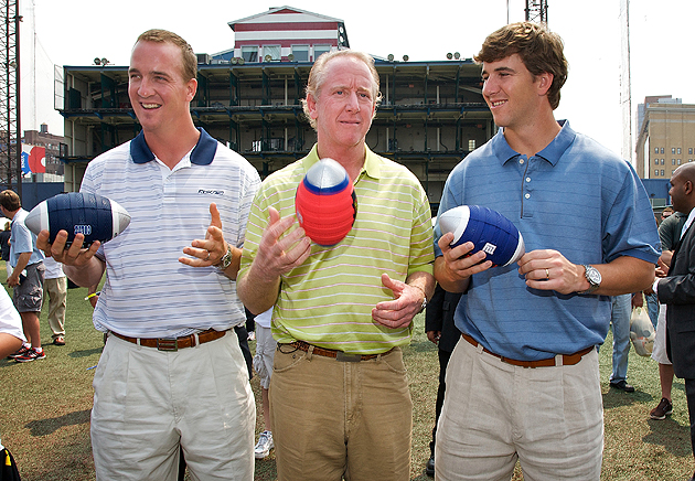 Archie Manning, right, watches his son., Denver Broncos