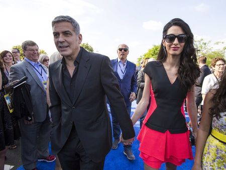 Cast member Clooney arrives with his wife Amal at the premiere of "Tomorrowland" at AMC theatres in Downtown Disney in Anaheim