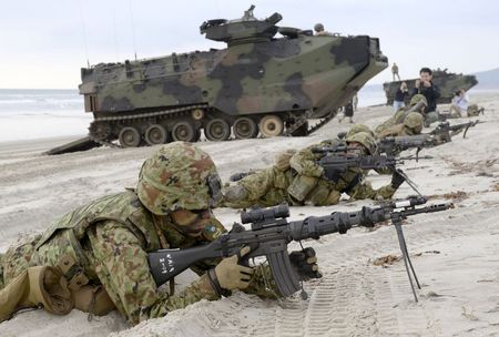 File photo of Japanese Ground Self-Defense Force's soldiers taking positions after landing on the beach near U.S. Marine Corps AAV7 armored personnel vehicles during a joint landing exercise at Marine Corps Base Camp Pendleton in California