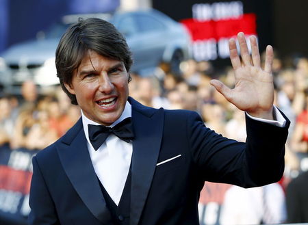 U.S. actor Cruise waves to fans upon his arrival for the world premiere of "Mission Impossible - Rogue Nation" in Vienna