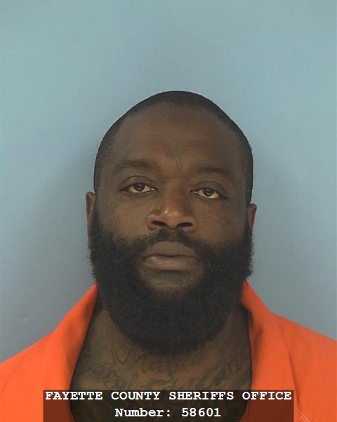 In this undated image released Wednesday, june 24, 2015 by the Fayette County (Ga.) Sheriff's Office Rick Ross poses for a photo. Ross is facing kidnapping and assault charges after a U.S. Marshals Service fugitive task force and deputies arrested him, Wednesday, June 24, 2015, at his mansion outside Atlanta. (Fayette County (Ga.) Sheriff's Office via AP)