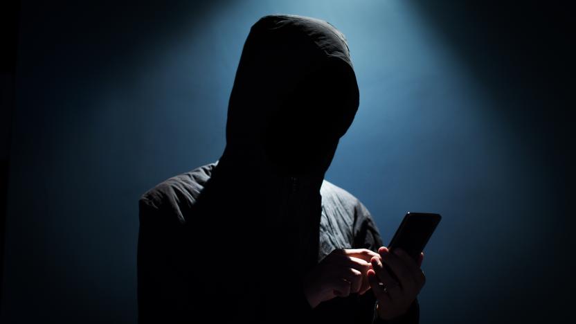 Hacker holding phone