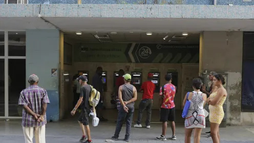 Alejandro Fonseca stood in line for several hours outside a bank in Havana hoping to withdraw Cuban pesos from an ATM, but when it was almost his turn, the cash ran out.  Converting those Cuban pesos to other currencies poses yet another challenge, as there are several, highly fluctuating exchange rates in the island.