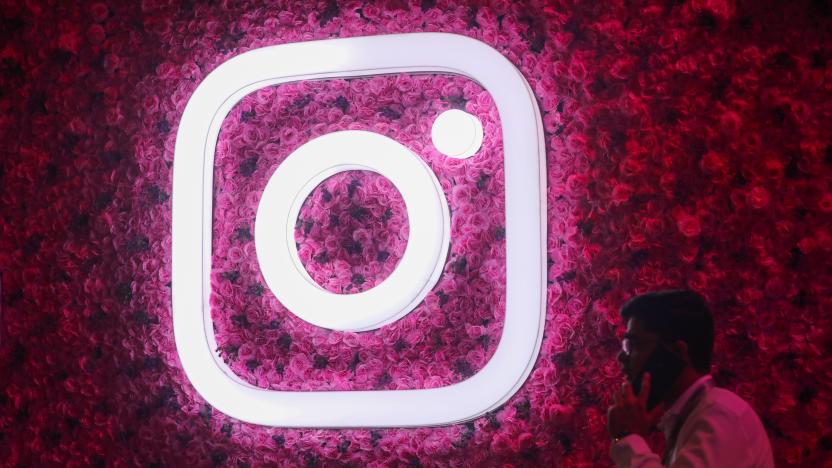 A man talks on the mobile phone next to a logo of Instagram, during a Meta event in Mumbai, India, 20 September, 2023. (Photo by Niharika Kulkarni/NurPhoto via Getty Images)