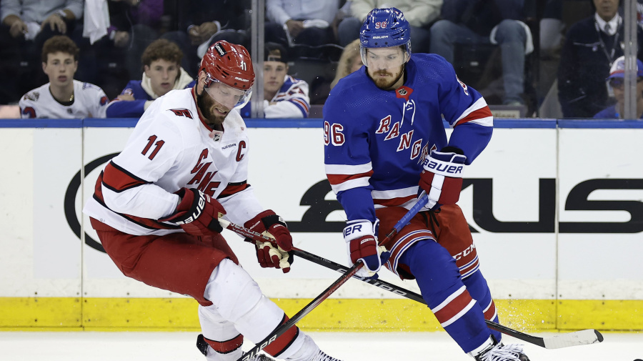 Associated Press - New York Rangers center Jack Roslovic (96) skates with the puck past Carolina Hurricanes center Jordan Staal in the first period during Game 5 of an NHL hockey Stanley Cup second-round playoff series, Monday, May 13, 2024, in New York. (AP Photo/Adam Hunger)