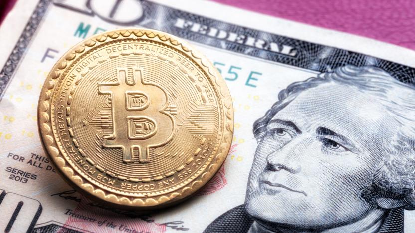 Kharkiv, Ukraine - March 10, 2019:bitcoin symbol on ten dollars background. cryptocurrency technologies concept. virtual money with real life.