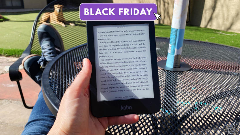 Photo of a person holding the Kobo Clara 2E on a sunny patio. A purple tag is overlaid that says "Black Friday."