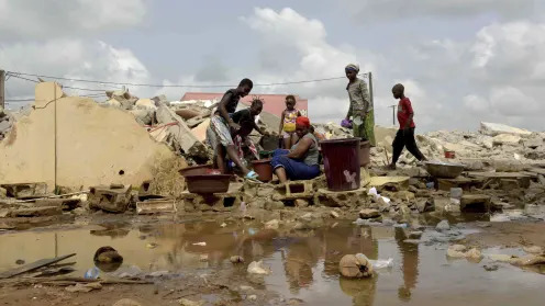 Dame Touré rushed to quickly gather what she could as bulldozers rolled into her neighborhood in Ivory Coast's fast-growing economic hub of Abidjan.  The Touré home was among hundreds crushed in a February wave of demolitions targeting Abidjan's underdeveloped areas.  The government says it's because of public health concerns as the poor areas — built along a lagoon in this port city of 6.3 million on West Africa's southern coast — suffer deadly floods during the rainy season.