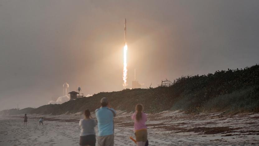 Spectators watch from Canaveral National Seashore as a SpaceX Falcon 9 rocket carrying 60 Starlink satellites launches from pad 39A at the Kennedy Space Center on October 6, 2020 in Cape Canaveral, Florida. This is the 13th batch of satellites placed into orbit by SpaceX as part of a constellation designed to provide broadband internet service around the globe.  (Photo by Paul Hennessy/NurPhoto via Getty Images)