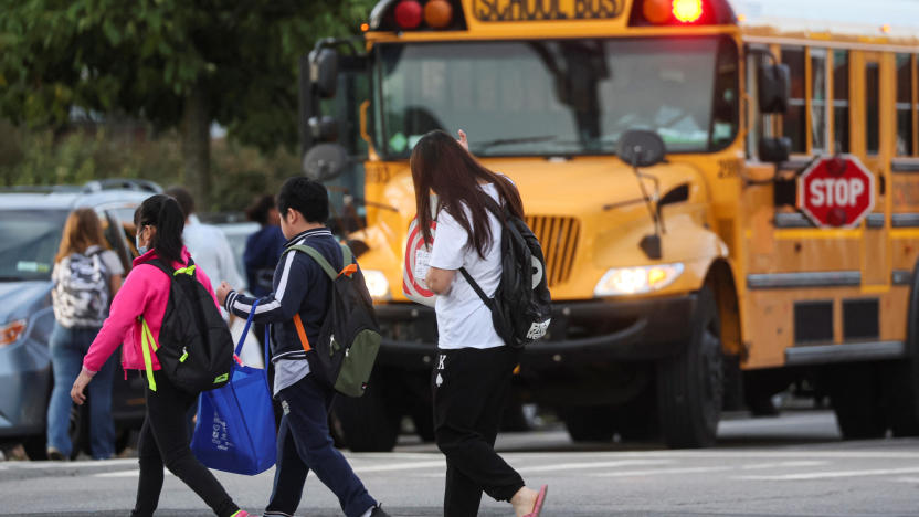 A family walks to school together on the first day of New York City Public Schools in the Brooklyn borough of New York, U.S., September 8, 2022.  REUTERS/Brendan McDermid