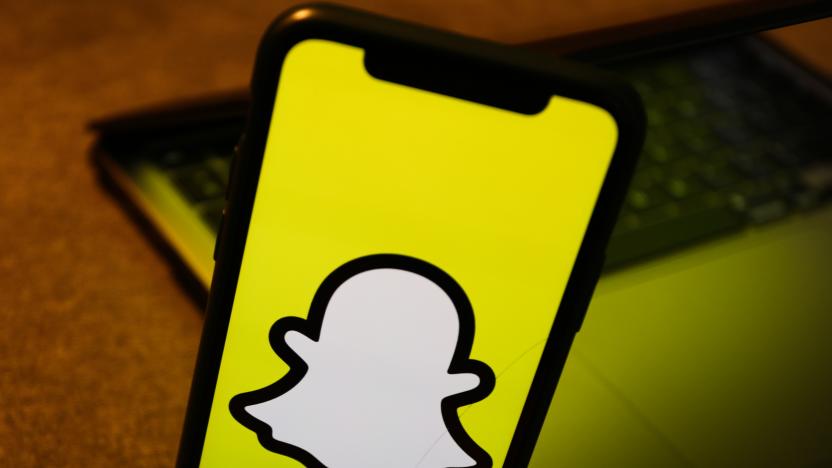 Snapchat logo displayed on a phone screen is seen with a laptop in the background in this illustration photo taken in Krakow, Poland on August 10, 2022. (Photo by Jakub Porzycki/NurPhoto via Getty Images)