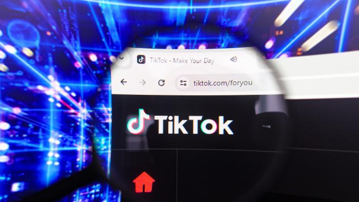 BRAZIL - 2024/04/17: In this photo illustration, the TikTok logo seen displayed on a computer screen through a magnifying glass. (Photo Illustration by Rafael Henrique/SOPA Images/LightRocket via Getty Images)