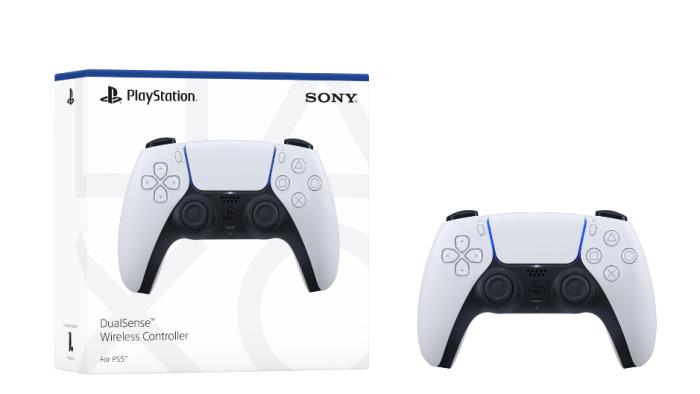 A white and black controller next to its box.