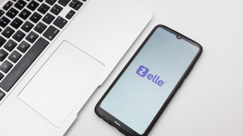 In this photo illustration a Zelle logo seen displayed on a smartphone screen on a desk next to a Macbook in Athens, Greece on September 29, 2022. (Photo Illustration by Nikolas Kokovlis/NurPhoto via Getty Images)