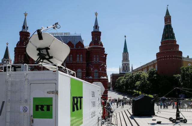 Vehicles of Russian state-controlled broadcaster Russia Today (RT) are seen near the Red Square in central Moscow, Russia June 15, 2018. Picture taken June 15, 2018.  REUTERS/Gleb Garanich