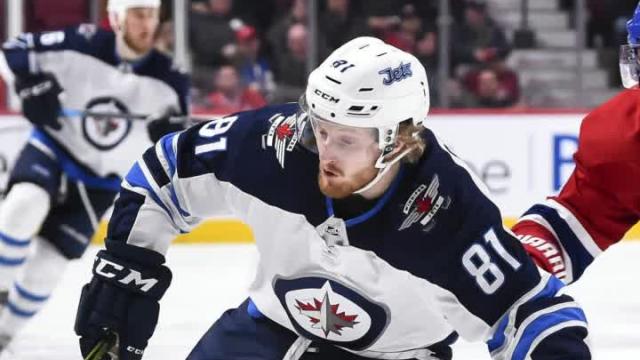 Jets reach 50 wins with 5-4 OT triumph over Canadiens