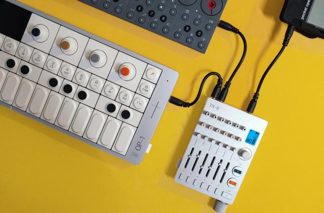The OP-1 Field synthesizer is pictured connected to the TX-6 mixer from Teenage Engineering.