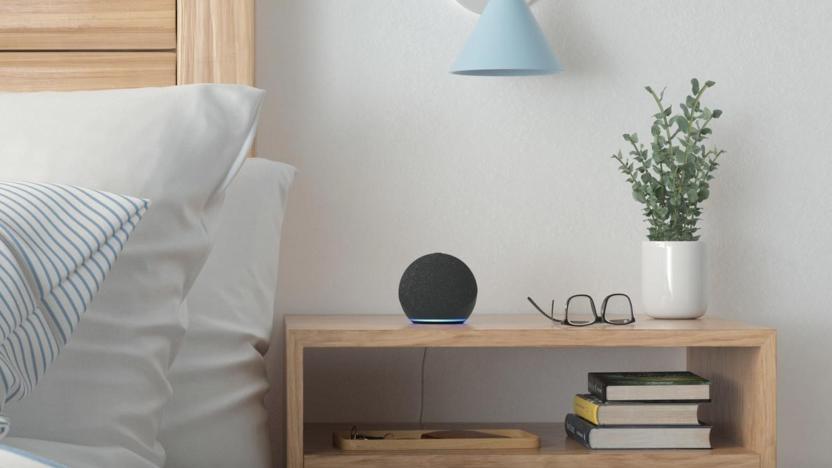 An Echo Dot on a nightstand. 