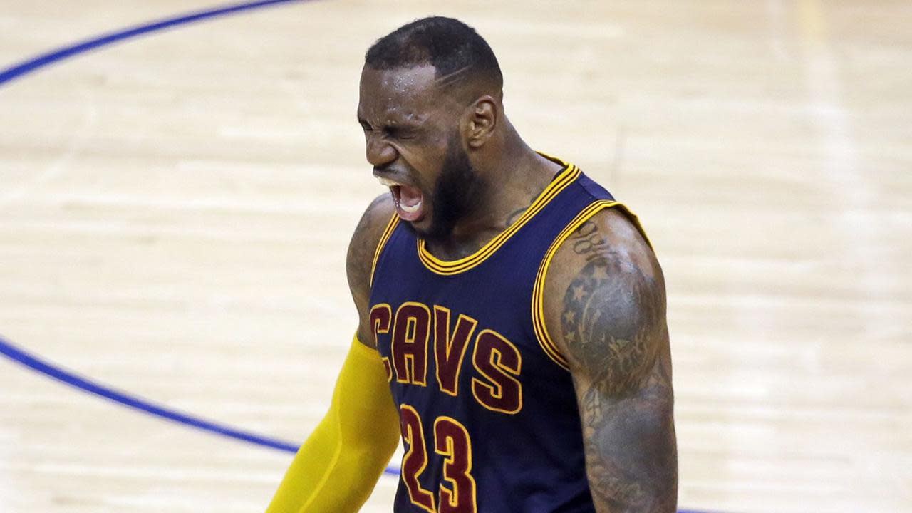 SEE IT: Cavaliers 'fan' wears burnt LeBron James jersey to game