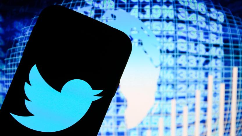 POLAND - 2020/11/20: In this photo illustration a Twitter social media app logo seen displayed on a smartphone with blue world data stats in the background. (Photo Illustration by Filip Radwanski/SOPA Images/LightRocket via Getty Images)